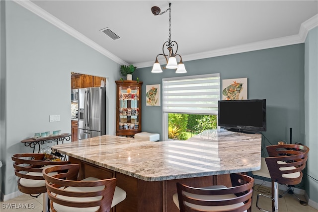 kitchen with a notable chandelier, light stone counters, stainless steel refrigerator with ice dispenser, and crown molding