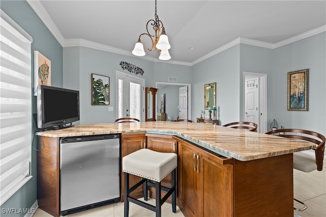 kitchen with stainless steel fridge, an inviting chandelier, and ornamental molding