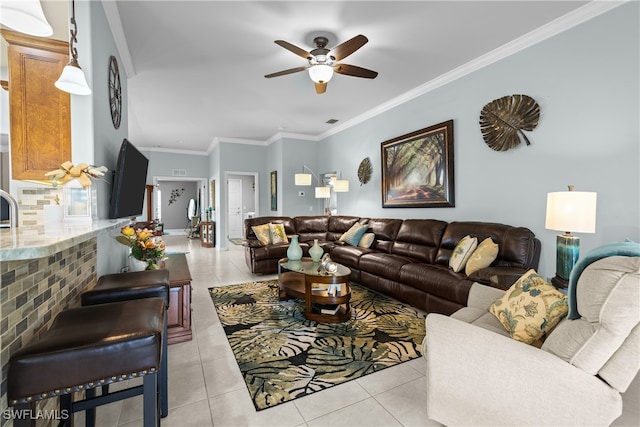 tiled living room featuring ceiling fan and ornamental molding