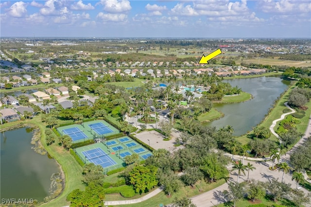 birds eye view of property with a water view