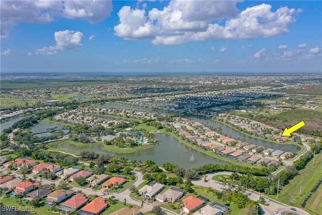 bird's eye view with a water view