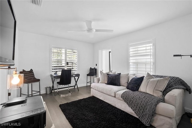 living room featuring hardwood / wood-style flooring and ceiling fan