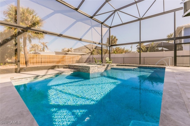 view of pool with glass enclosure, an in ground hot tub, and a patio