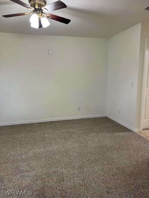 empty room with carpet flooring and ceiling fan