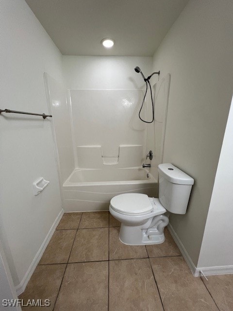 bathroom with toilet, shower / bathtub combination, and tile patterned flooring