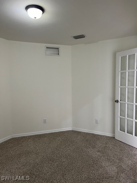 unfurnished room featuring carpet floors