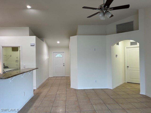 interior space featuring ceiling fan and light tile patterned floors