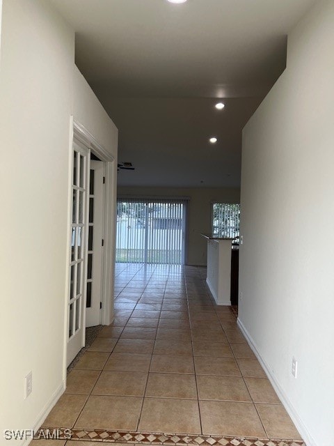 hallway featuring light tile patterned floors