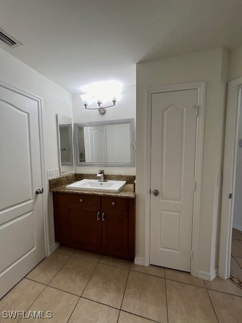 bathroom featuring vanity and tile patterned flooring