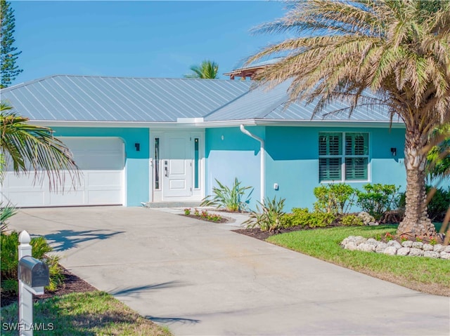 single story home featuring a garage