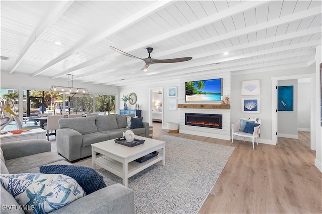 living room with beam ceiling, light hardwood / wood-style flooring, ceiling fan, and wooden ceiling