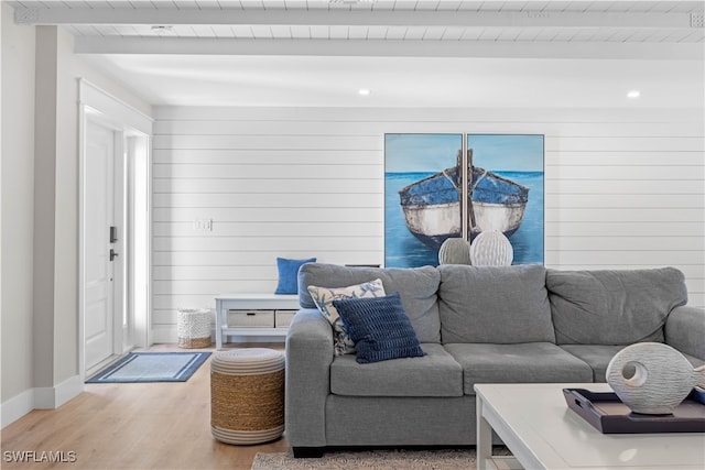 living room with beam ceiling, wood-type flooring, and wooden ceiling