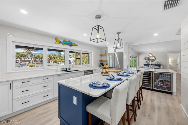 kitchen with a wealth of natural light and a kitchen island