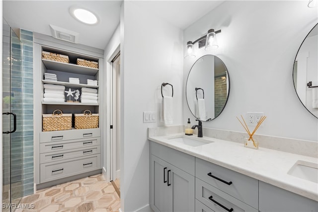 bathroom with vanity and an enclosed shower