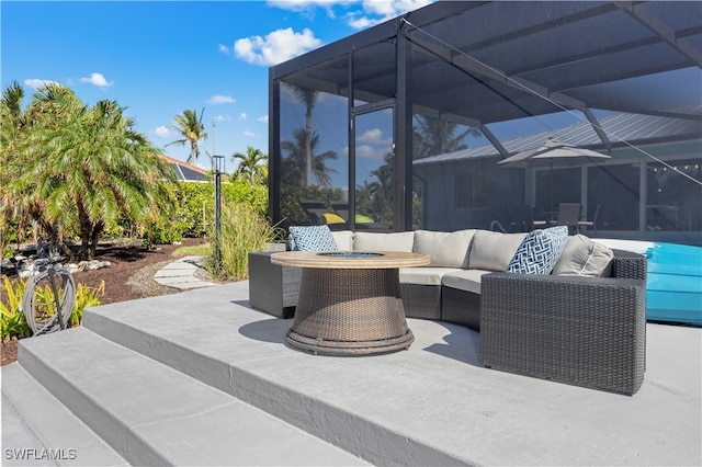 view of patio featuring glass enclosure and an outdoor hangout area