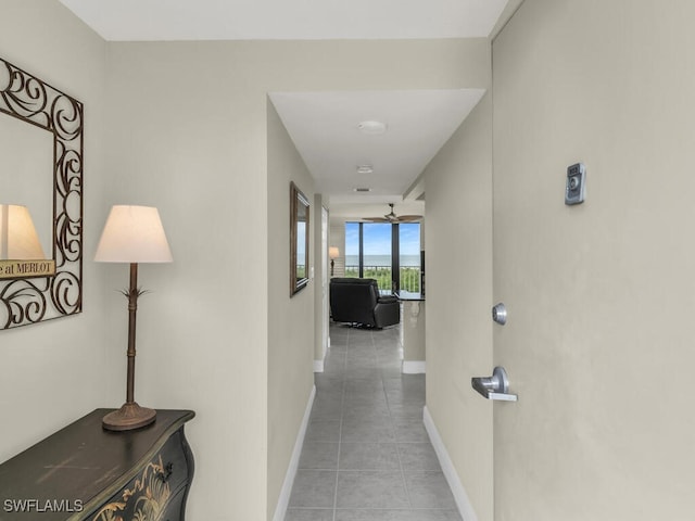 260 Seaview Ct Unit 803, Marco Island, FL 34145 - hall with tile patterned flooring and baseboards