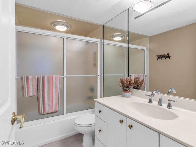 260 Seaview Ct Unit 803, Marco Island, FL 34145 - full bathroom with toilet, tile patterned flooring, bath / shower combo with glass door, and vanity