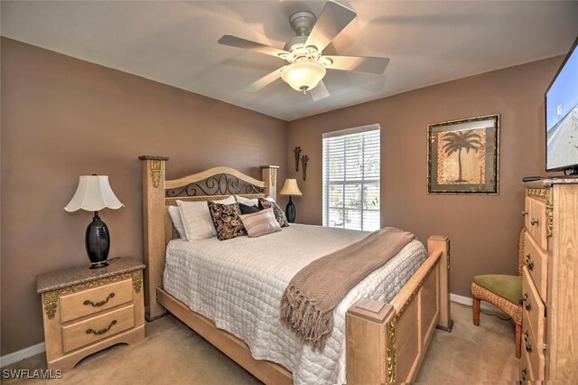 bedroom featuring light colored carpet and ceiling fan