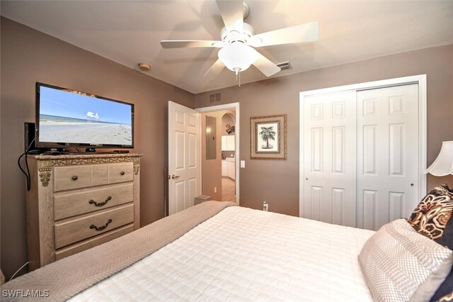 bedroom with ceiling fan and a closet