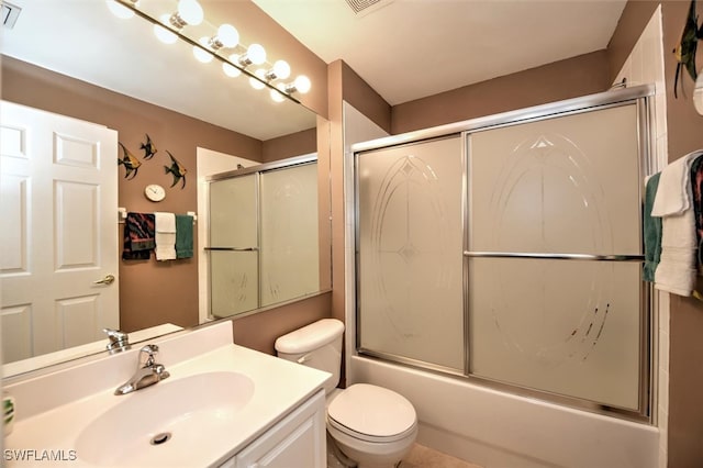 full bathroom featuring toilet, bath / shower combo with glass door, and vanity