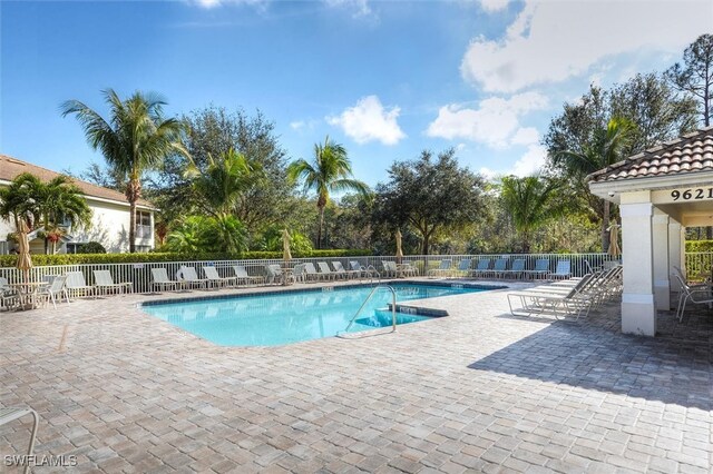 view of swimming pool featuring a patio area