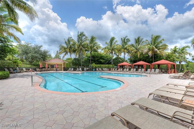 view of swimming pool featuring a gazebo and a patio area