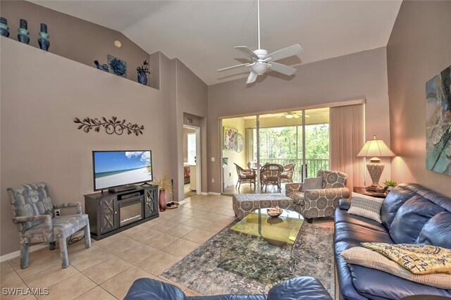 tiled living room featuring high vaulted ceiling and ceiling fan