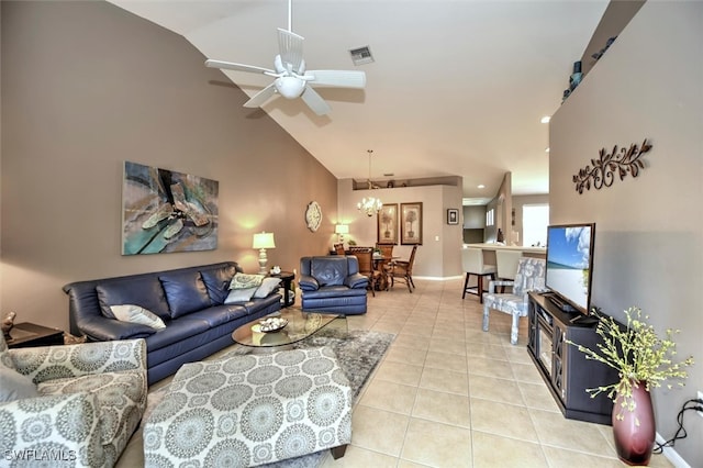 tiled living room featuring ceiling fan with notable chandelier and lofted ceiling