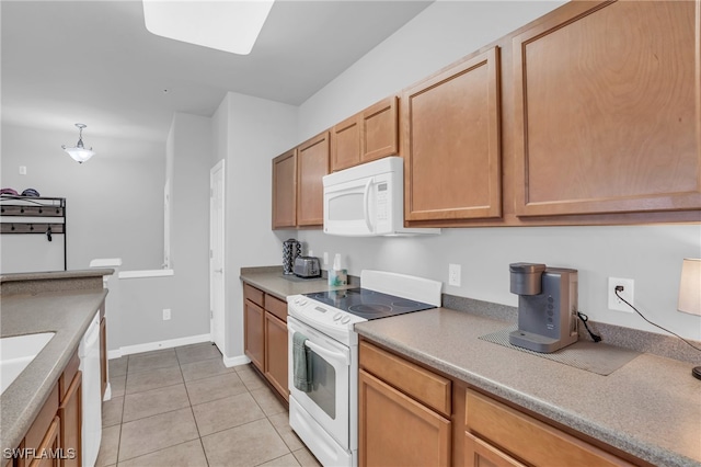 kitchen featuring white appliances and light tile patterned floors