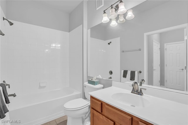 full bathroom with vanity, tile patterned flooring, toilet, and tiled shower / bath combo