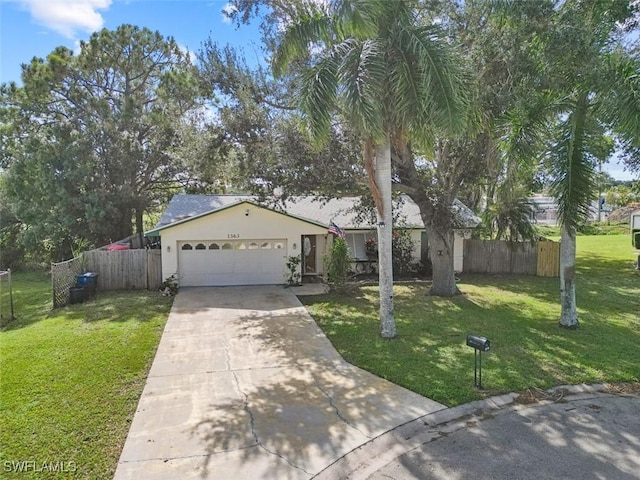 view of front of home featuring a front yard and a garage