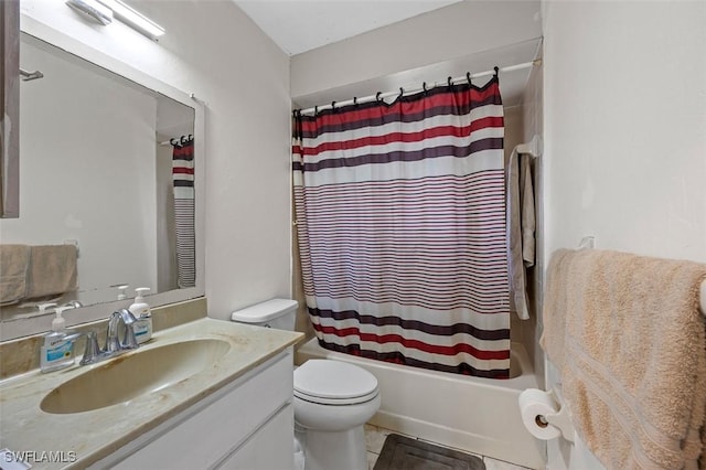 full bath with vanity, tile patterned floors, toilet, and shower / bath combo with shower curtain