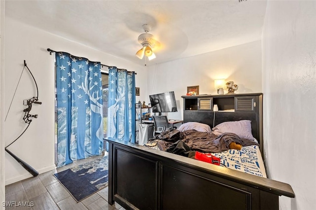 bedroom with a ceiling fan and wood finished floors