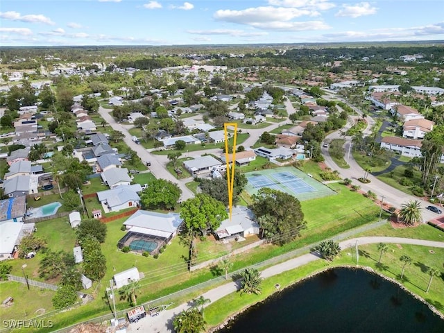 aerial view with a residential view and a water view