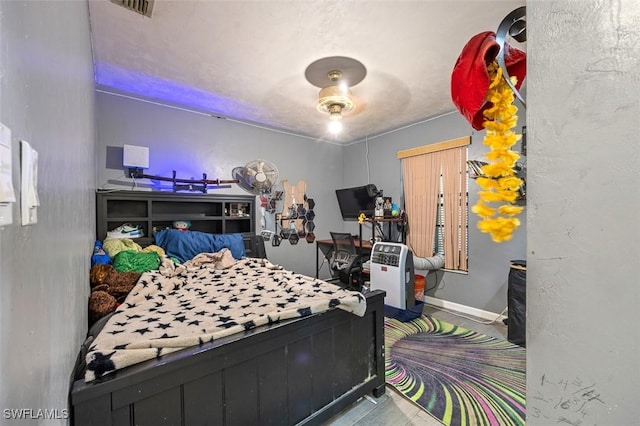 bedroom featuring visible vents and baseboards