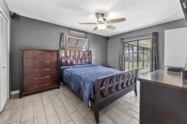 bedroom featuring a ceiling fan, wood finish floors, and access to outside