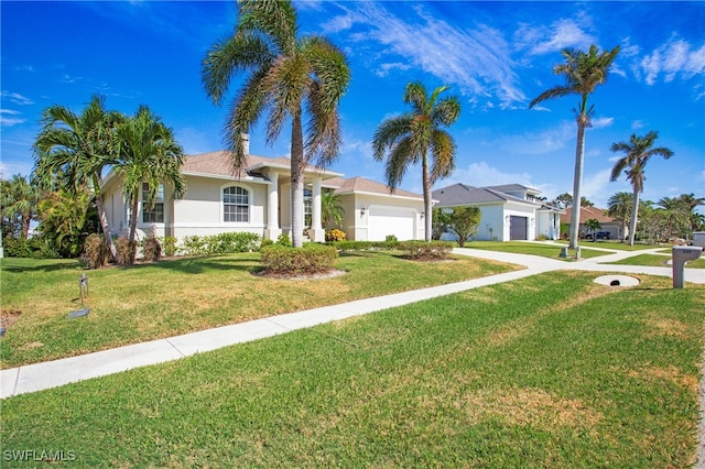 ranch-style home with a garage and a front yard