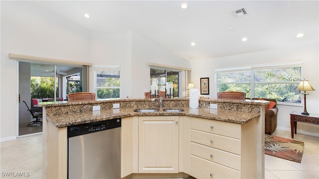 kitchen featuring dishwasher, an island with sink, and a healthy amount of sunlight