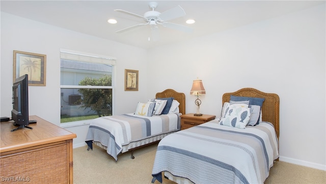 bedroom with light colored carpet and ceiling fan