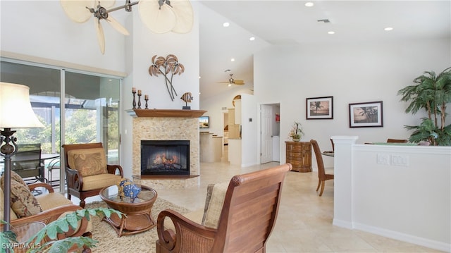 tiled living room with high vaulted ceiling and ceiling fan