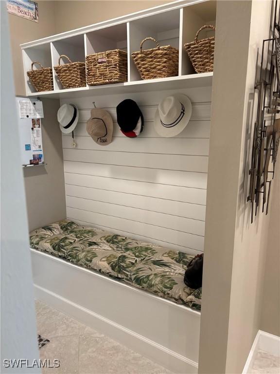 mudroom with tile patterned floors