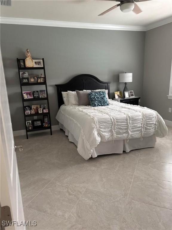 bedroom featuring crown molding and ceiling fan