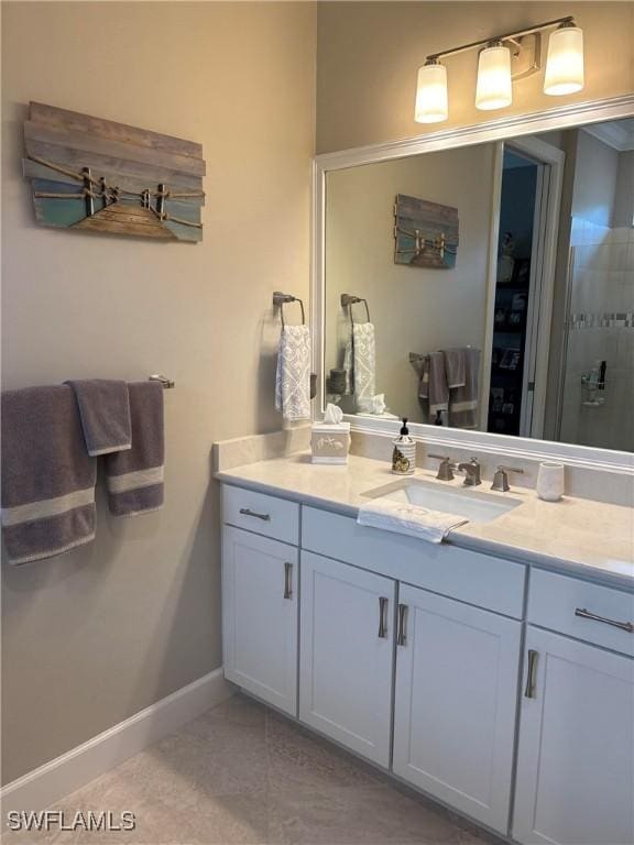 bathroom featuring tile patterned flooring and vanity