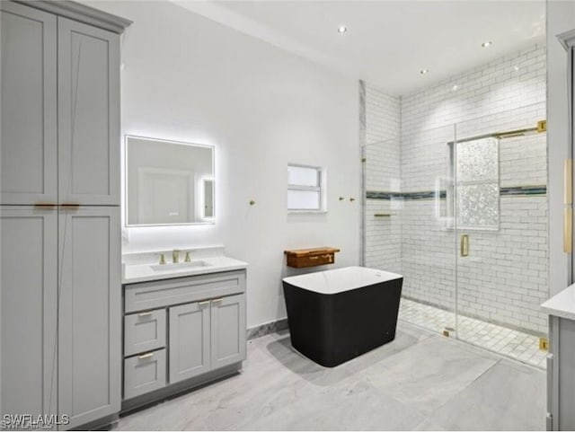 bathroom with vanity and plus walk in shower