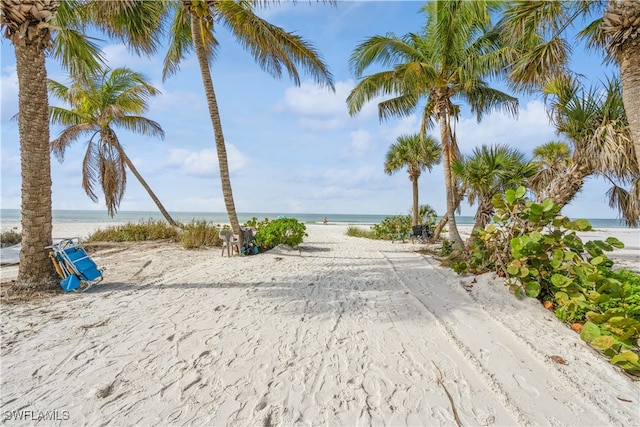 view of home's community featuring a water view and a view of the beach