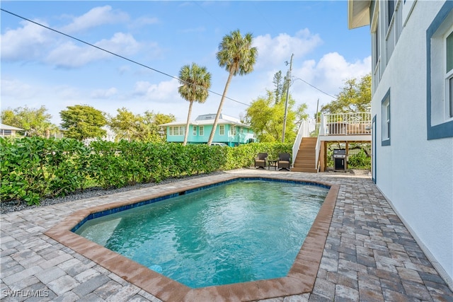 view of pool featuring a patio