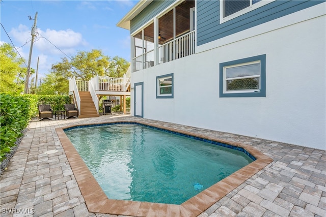 view of swimming pool with a patio