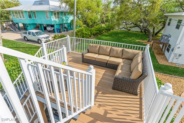 wooden deck with an outdoor hangout area