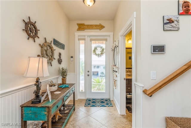 entryway featuring light tile patterned floors