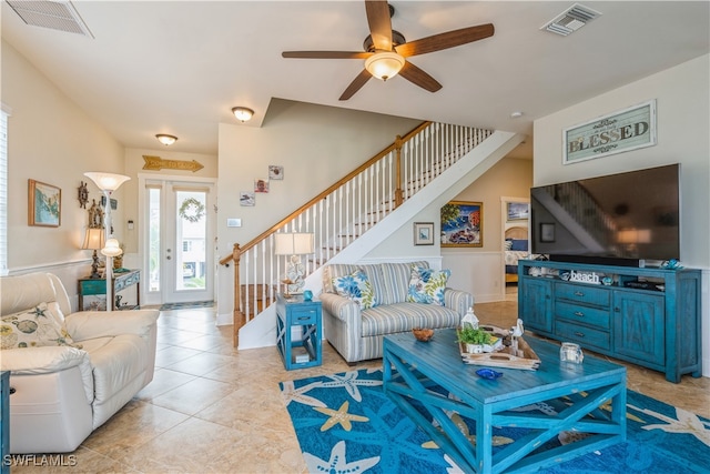 living room featuring ceiling fan and light tile patterned floors